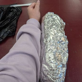 Hermanos Locos Tacos - Loco burrito with my arm for comparison (hard to eat an open face monstrosity like this clean!) - Tacos Near Me - Minneapolis, Minnesota