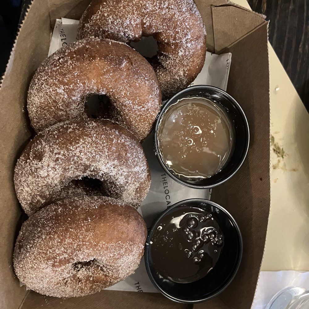 The Local Kitchen & Drinks - Box of Donuts with chocolate or caramel sauce - New American Near Me - Waltham, Massachusetts The Local Kitchen & Drinks - Box of Donuts with chocolate or caramel sauce - New American Near Me - Waltham, Massachusetts