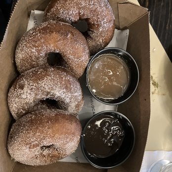 The Local Kitchen & Drinks - Box of Donuts with chocolate or caramel sauce - New American Near Me - Waltham, Massachusetts