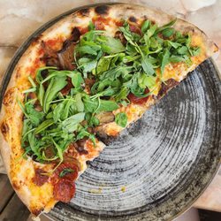 Pizzeria Renzo - 1/2 of my pizza - spicy salami, oyster mushroom, and arugula! So delicious - the crust is thin and crisp