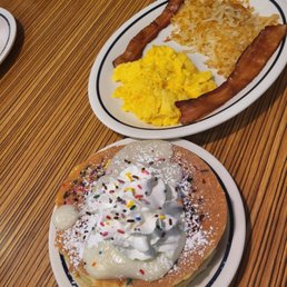 two plates of breakfast food on a table two plates of breakfast food on a table