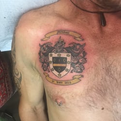 Soular Tattoo - The hubby getting his crest of arms done as well. Awesome eh