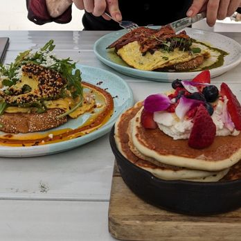 Bluestone Lane - Lemon ricotta pancakes, soft chili scramble with avocado, I don't remember what my partner ordered - Coffee & Tea Near Me - Orange, California
