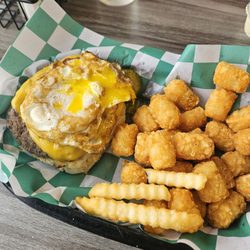 Lid’s Bar & Grill - Cheese burger with fried egg over easy, tator tots. Everything so good.