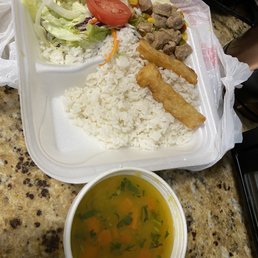 Pork with vegetables, yuca, rice, "salad", and soup Pork with vegetables, yuca, rice, "salad", and soup