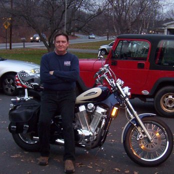 Pizza Perfect - a man sitting on a motorcycle - Pizza Near Me - Trucksville, Pennsylvania
