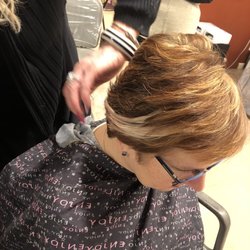 Instyle Designs Salon & Spa - Sharon feathered in my first hair extension. Love the the color and my highlights.