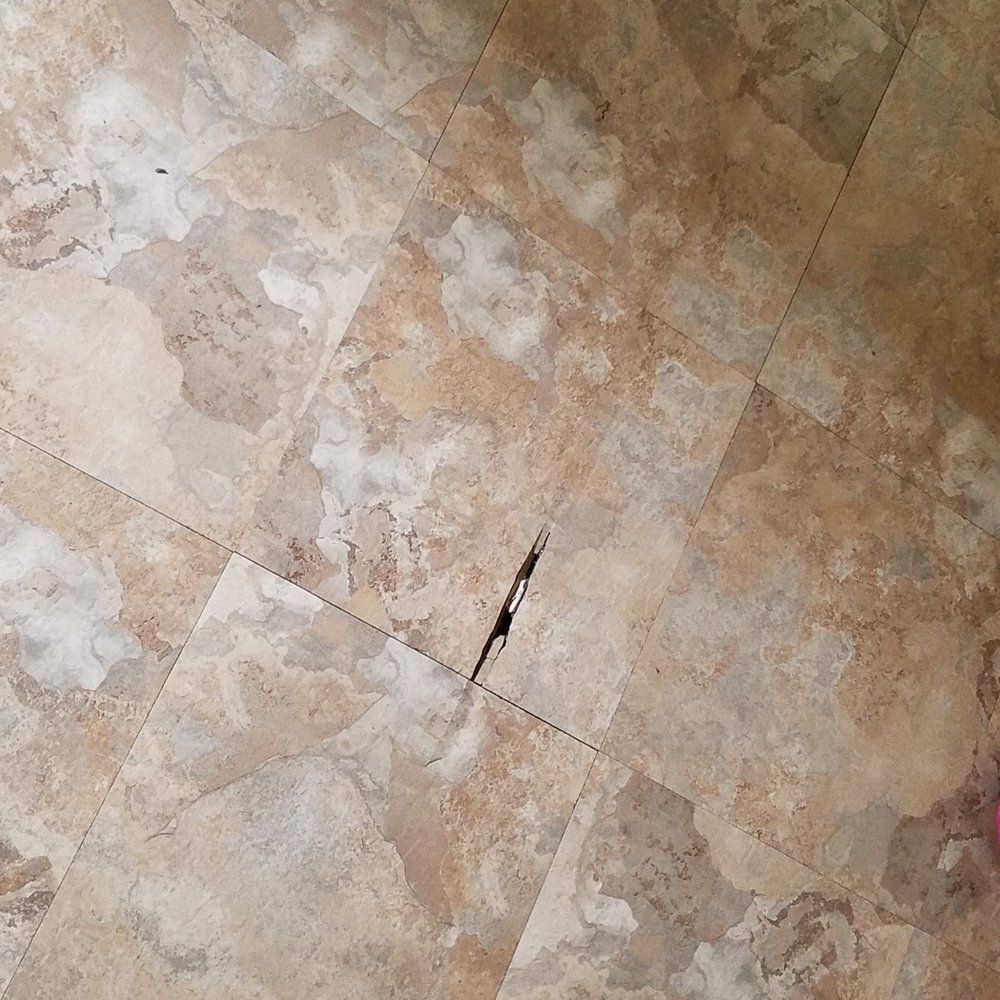 Transylvania Construction - Damaged tile before repair - General Contractors Near Me - Lincolnwood, Illinois Transylvania Construction - Damaged tile before repair - General Contractors Near Me - Lincolnwood, Illinois