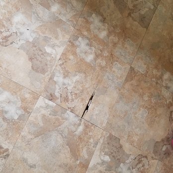 Transylvania Construction - Damaged tile before repair - General Contractors Near Me - Lincolnwood, Illinois Transylvania Construction - Damaged tile before repair - General Contractors Near Me - Lincolnwood, Illinois