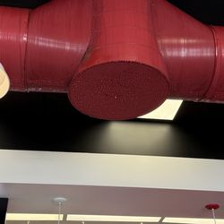 Five Guys - Condensation covered ducts dripping all over the floor and potentially on customers.