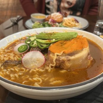 El Sazon Cocina & Tragos - Birria ramen with bone marrow and 2 birria taquitos - Tacos Near Me - Minneapolis, Minnesota El Sazon Cocina & Tragos - Birria ramen with bone marrow and 2 birria taquitos - Tacos Near Me - Minneapolis, Minnesota