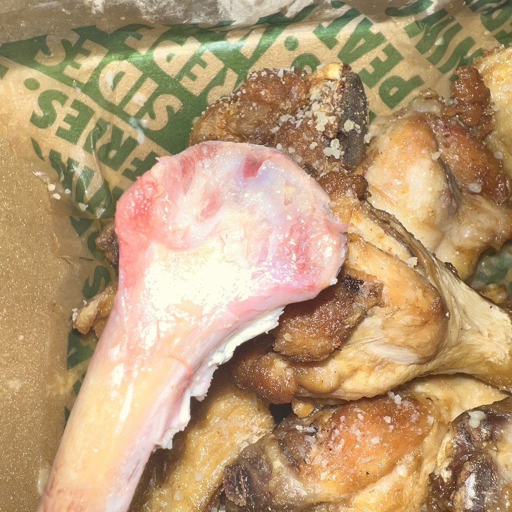 garlic parm wings with barely anything on it. and the chicken that wasn't cooked through. & the "fries" garlic parm wings with barely anything on it. and the chicken that wasn't cooked through. & the "fries"