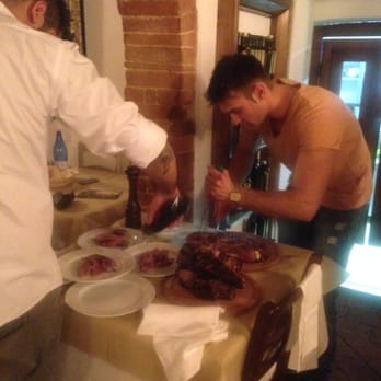 Il Grillo Moro - Staff cutting Battuta for guests. - Pizza Near Me - SI, SI