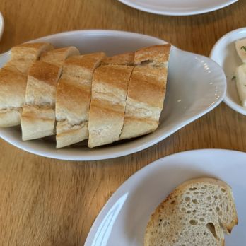 Dos Besos - Appetizer Bread with olive oil & butter - Spanish Near Me - Pasadena, California Dos Besos - Appetizer Bread with olive oil & butter - Spanish Near Me - Pasadena, California