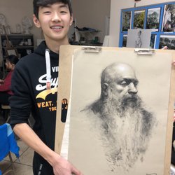 Ichen Art Academy - Kevin (13), with his charcoal portrait drawing