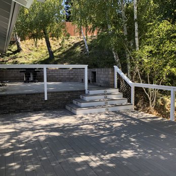 Owen Construction - a deck with steps leading to a patio - General Contractors Near Me Owen Construction - a deck with steps leading to a patio - General Contractors Near Me
