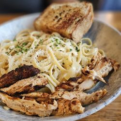 Earls Kitchen + Bar - Chicken alfredo with garlic bread at an additional charge.