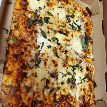 Pizzasaurus Rex - Cheese with sausage and basil - Pizza Near Me - Sacramento, California Pizzasaurus Rex - Cheese with sausage and basil - Pizza Near Me - Sacramento, California