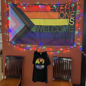 Wild Man Brewing Gastropub - two chairs and a welcome sign - Pubs Near Me - Olympia, Washington