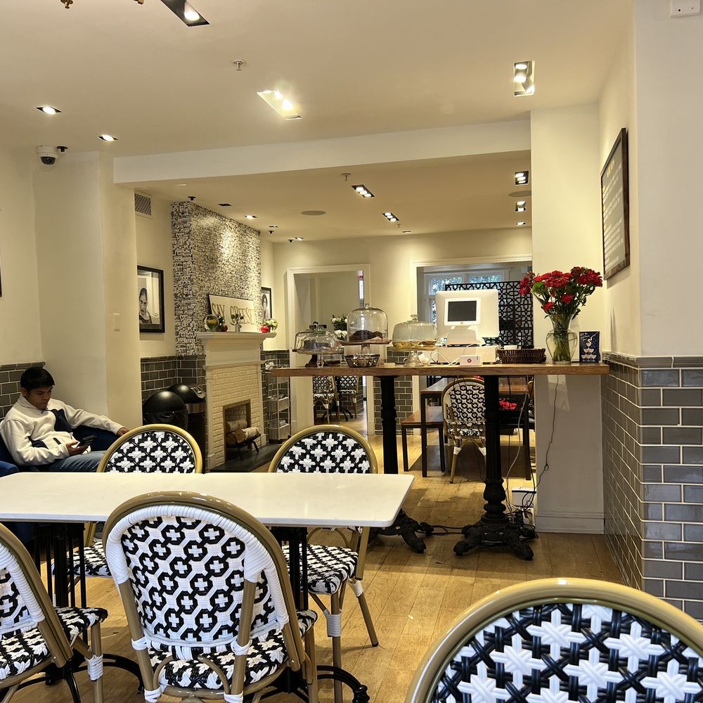 a man sitting at a table in a restaurant a man sitting at a table in a restaurant