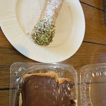 Scungilli's - Pistachio Cannoli and Eclair Cake - Italian Near Me - Waterford, Wisconsin Scungilli's - Pistachio Cannoli and Eclair Cake - Italian Near Me - Waterford, Wisconsin