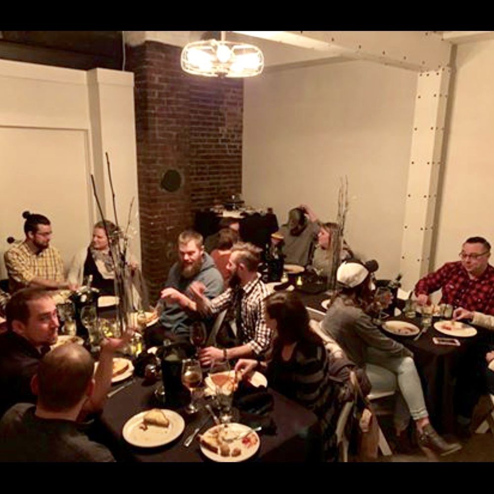 The Rev - a group of people sitting around a table - Beer, Wine & Spirits Near Me - Eau Claire, Wisconsin The Rev - a group of people sitting around a table - Beer, Wine & Spirits Near Me - Eau Claire, Wisconsin