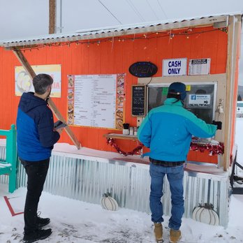 Arias Taqueria - two people standing outside in the snow - Food Trucks Near Me - Angel Fire, New Mexico
