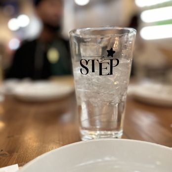 Step Korean Bistro - a glass of water on a table - Korean Near Me - Sparks, Nevada Step Korean Bistro - a glass of water on a table - Korean Near Me - Sparks, Nevada