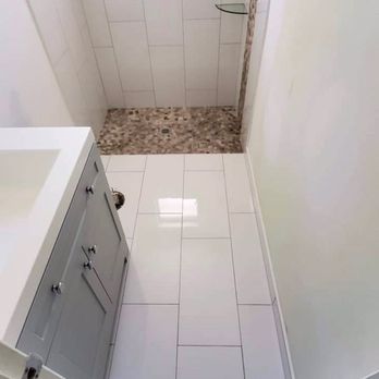 United Tile Service - a white bathroom with a shower - Tiling Near Me United Tile Service - a white bathroom with a shower - Tiling Near Me