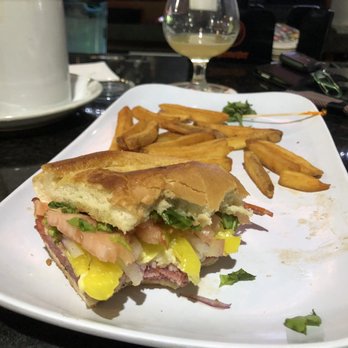 Rivals Brew Pub - 1/2 eaten half Italiano and half of the half of fries.... - Sports Bars Near Me - Middleburg Heights, Ohio