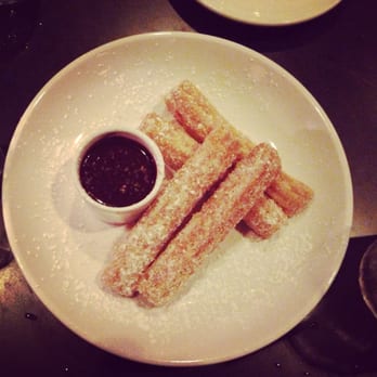 Delicia - Churros with chocolate sauce. The perfect topper to any meal. - Latin American Near Me - Indianapolis, Indiana Delicia - Churros with chocolate sauce. The perfect topper to any meal. - Latin American Near Me - Indianapolis, Indiana
