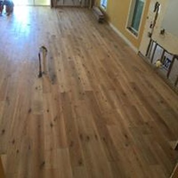 Carpets By Five-Four - a hardwood floor in a living room - Carpeting Near Me - Fort Pierce, Florida