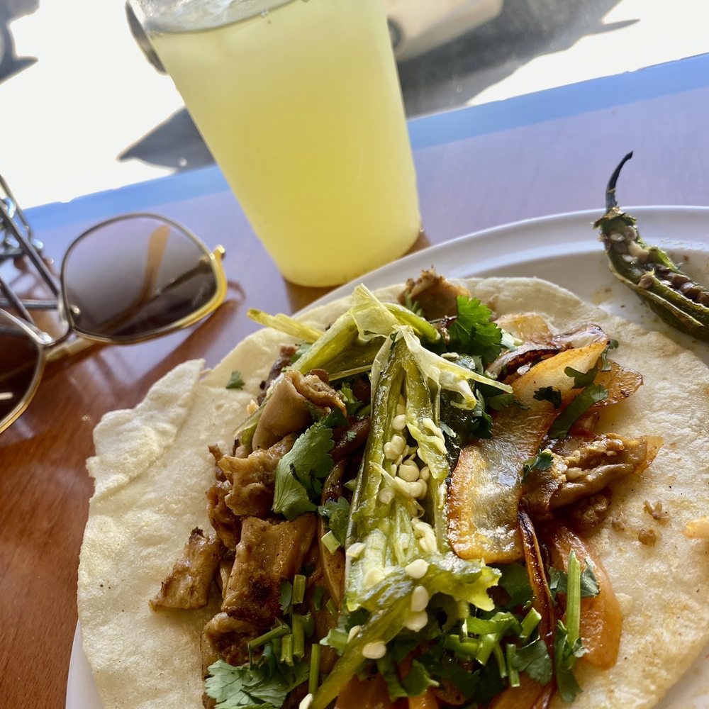 Tripa taco on a homemade corn tortilla and agua de piña (fresh pineapple water) Tripa taco on a homemade corn tortilla and agua de piña (fresh pineapple water)
