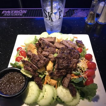 Skye Lemooore - a plate of salad with meat and vegetables - Lounges Near Me - Lemoore, California