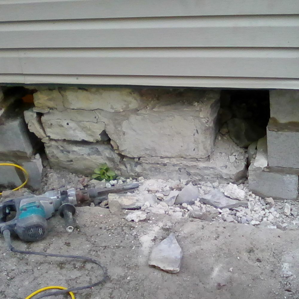 Burriss Masonry - Brad placed three sections of cement blocks, allowing the other three, old stone sections, to hold up the wall. - Masonry/Concrete Near Me - Kingston, Ontario Burriss Masonry - Brad placed three sections of cement blocks, allowing the other three, old stone sections, to hold up the wall. - Masonry/Concrete Near Me - Kingston, Ontario