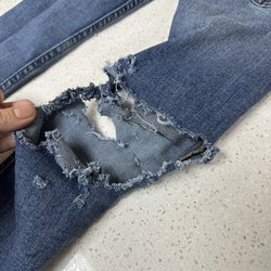 Launderland - Brand new pair of jeans shredded from a malfunctioning machine. Owners ignoring the issue.