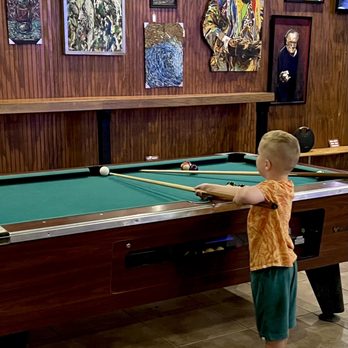 Brew Life Brewing - a young boy playing pool - Breweries Near Me - Sarasota, Florida Brew Life Brewing - a young boy playing pool - Breweries Near Me - Sarasota, Florida