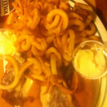 Flanigan's - Philly Cheese steak buried under a file of ordinary curly fries - American Near Me - Oakland Park, Florida