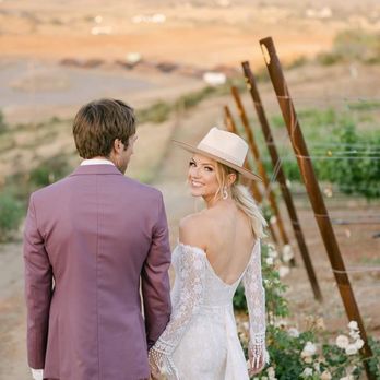Hillside Ranch Vineyard - a bride and groom walking down a dirt road - Wineries Near Me - Jamul, California Hillside Ranch Vineyard - a bride and groom walking down a dirt road - Wineries Near Me - Jamul, California