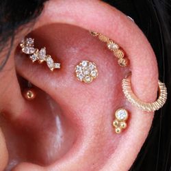 HTC Studios - Tempe - Curation time! Flat, Rook, and Helix piercings wearing jewelry from BVLA and Buddha Jewelry in yellow gold