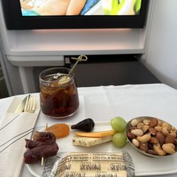 Cheese, nuts, meat, and a rum and coke! Cheese, nuts, meat, and a rum and coke!
