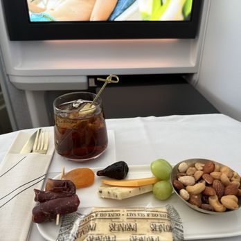 Alaska Airlines - Cheese, nuts, meat, and a rum and coke! - Airlines Near Me - Seattle, Washington