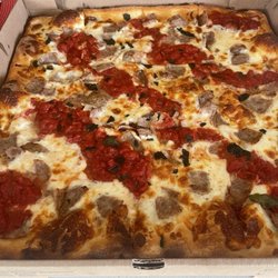 Racaniellos Pizzeria - Large Grandma pie with sausage.