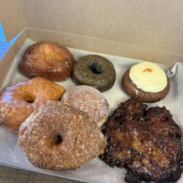 Apple Fritter, Malasada, Carrot Cake with Cream Cheese,   Glazed, Blueberry Glazed, Glazed Round and Coconut