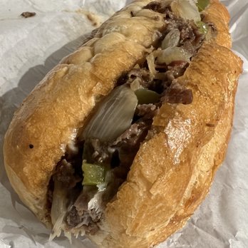 Tat's Delicatessen - 8" Philly cheesesteak with provolone, onions, and fried green peppers - Delis Near Me - Seattle, Washington Tat's Delicatessen - 8" Philly cheesesteak with provolone, onions, and fried green peppers - Delis Near Me - Seattle, Washington