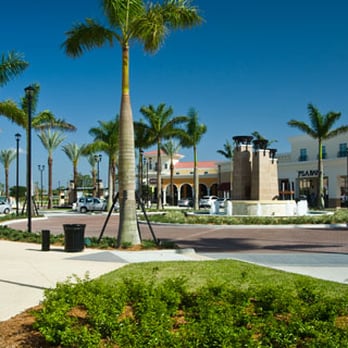 Delray Marketplace - The 3 torch towers at this round about fountain is lit up with fire at night! It's awesome! - Shopping Centers Near Me - Delray Beach, Florida Delray Marketplace - The 3 torch towers at this round about fountain is lit up with fire at night! It's awesome! - Shopping Centers Near Me - Delray Beach, Florida
