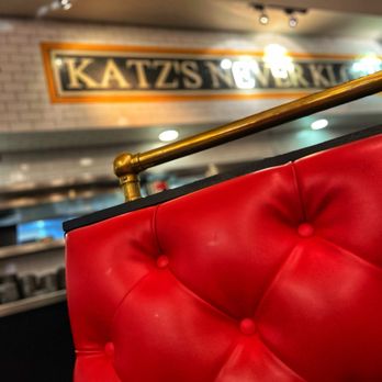 Katz's - a red chair in a restaurant - Delis Near Me - Shenandoah, Texas