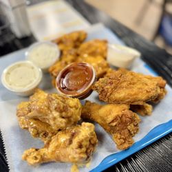 Wingman by Blue 42 - Boom boom, maple rub,& 911 sauce in container.