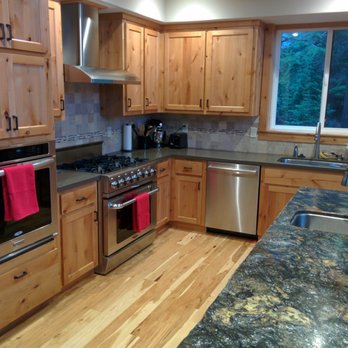 Robert Wise Construction - a kitchen with granite countertops and stainless steel appliances - General Contractors Near Me Robert Wise Construction - a kitchen with granite countertops and stainless steel appliances - General Contractors Near Me