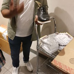 Showing us how they stretch the shoes...